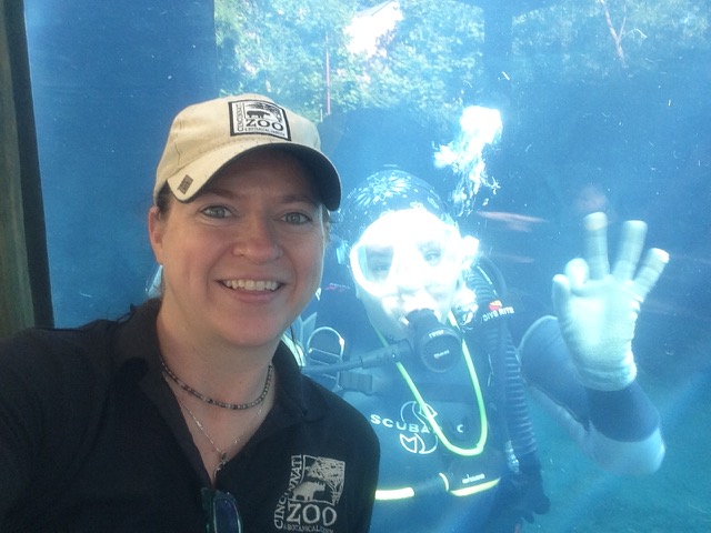 Jen taking a selfie with a scuba diver inside the Hippo pool.