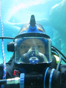 A selfie of Jen in full scuba diving equipment at the bottom of the zoo's polar bear pool.